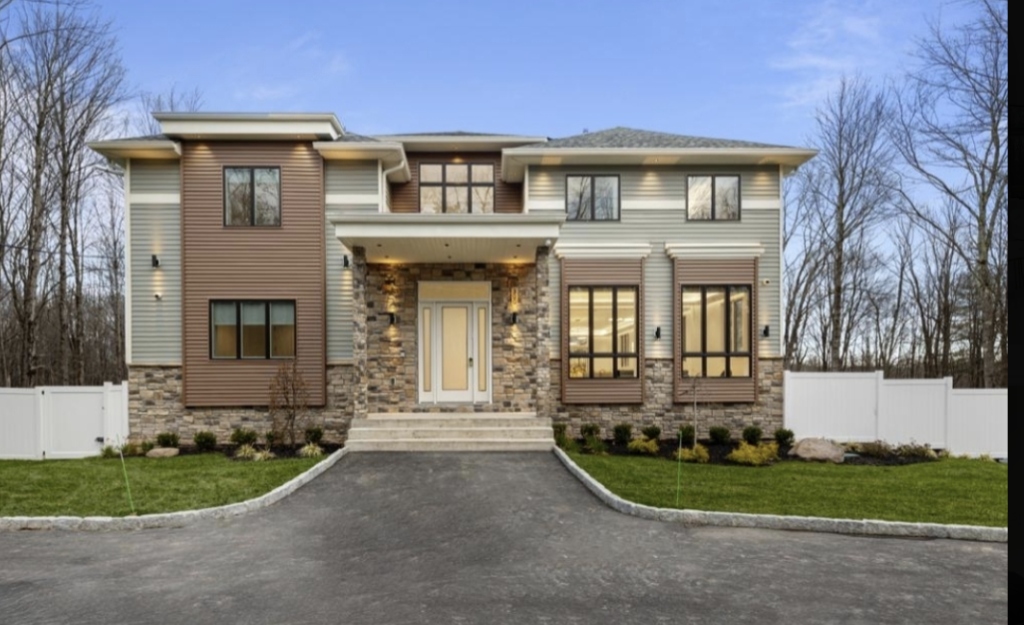 The OakRest House modern architectural stone and wood exterior facade